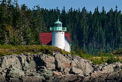 Little River Lighthouse Over Rocky Island Shore in Maine